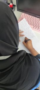 Woman writing testimonial